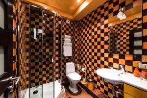 a bathroom with a toilet and a sink at Apart residences by the sea in Palanga +53 photos