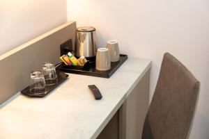 
a kitchen counter with a blender and a cup of coffee at Garda Life in Riva del Garda
