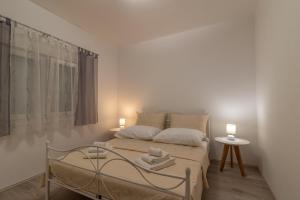 Katil atau katil-katil dalam bilik di Apartment Matea