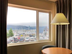 a large window with a view of a harbor at Breeze Inn Motel in Seward