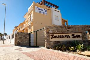 a building with a sign that reads zaza son at Zahara Sol Villas y Apartamentos by QHotels in Zahara de los Atunes