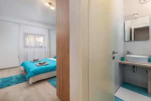 Posteľ alebo postele v izbe v ubytovaní Guest House Ravnić