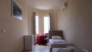 Llit o llits en una habitació de Villa Balani