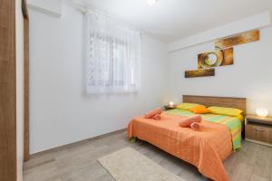Posteľ alebo postele v izbe v ubytovaní Guest House Ravnić