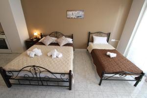 A bed or beds in a room at Arianna Studios 7