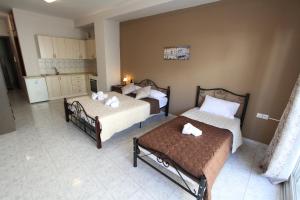 A bed or beds in a room at Arianna Studios 7