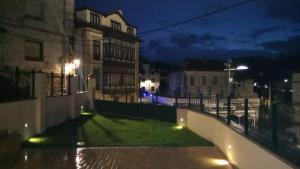 a view of a city street at night at Casa Santiago in Comillas