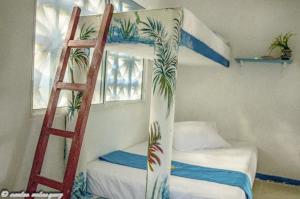 Posteľ alebo postele v izbe v ubytovaní Cabañas Los Juanchos Coveñas
