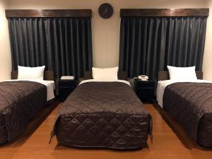 Cama o camas de una habitación en E Hotel Warabi