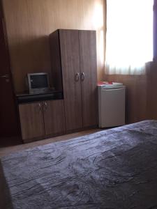 Un pat sau paturi într-o cameră la Vila Nusa