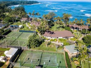 an aerial view of tennis courts at the beach at Ocean Villas at Turtle Bay in Kahuku