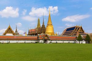 a large building with a green field in front of it at New Siam II in Bangkok