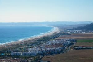 an aerial view of a beach and the ocean at Zahara Sol Villas y Apartamentos by QHotels in Zahara de los Atunes