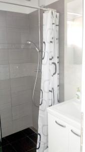 a white bathroom with a shower and a sink at Nina Villa in Rab +68 photos