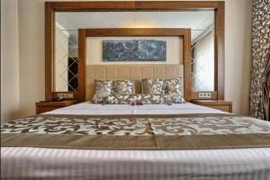 Ένα ή περισσότερα κρεβάτια σε δωμάτιο στο City Hotel Residence