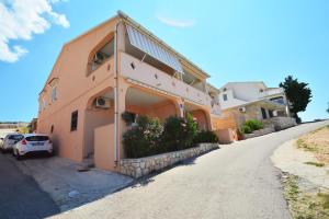 a house on the side of a road at Apartments Barbati in Kustići