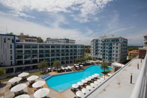 arial view of a hotel with a swimming pool and umbrellas at Grand Beach Condo B404 by Malai in Klaeng