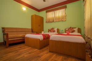 Postel nebo postele na pokoji v ubytování Hotel Green Orchid
