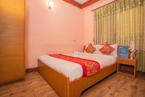 Postel nebo postele na pokoji v ubytování Hotel Green Orchid