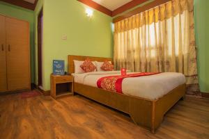 Postel nebo postele na pokoji v ubytování Hotel Green Orchid