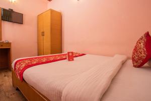 Postel nebo postele na pokoji v ubytování Hotel Green Orchid