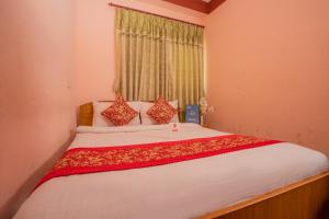 Postel nebo postele na pokoji v ubytování Hotel Green Orchid