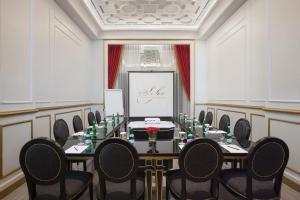 a meeting room with a long table and chairs at Sofia Boutique Residence in Yogyakarta +26 photos