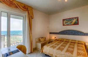 Postel nebo postele na pokoji v ubytování Hotel Elpiro