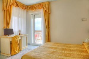 Postel nebo postele na pokoji v ubytování Hotel Elpiro