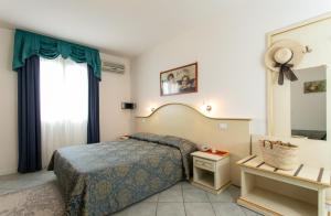 Postel nebo postele na pokoji v ubytování Hotel Elpiro