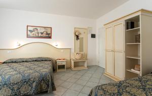 Postel nebo postele na pokoji v ubytování Hotel Elpiro