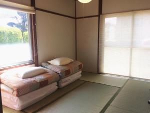 Hostel Fuji Matsuyama Baseにあるベッド