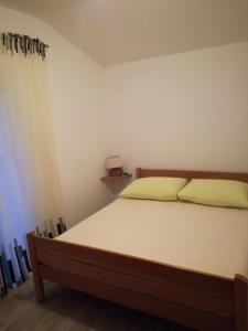 Postel nebo postele na pokoji v ubytování Jurić Apartments