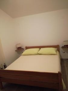 Postel nebo postele na pokoji v ubytování Jurić Apartments