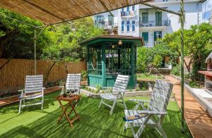 a group of chairs and a gazebo in a yard at PLR-Royal luxury apartment in Split