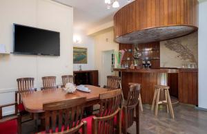 a dining room with a wooden table and chairs at PLR-Royal luxury apartment in Split