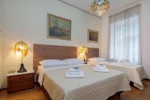 a bedroom with two beds with towels on them at PLR-Royal luxury apartment in Split