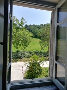 an open window with a view of a field at Casa Vacanze da Peppa in Grottazzolina
