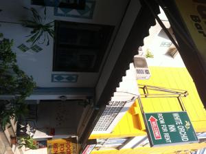an overhead view of a building with signs on it at White Orchid Inn I in Bangkok