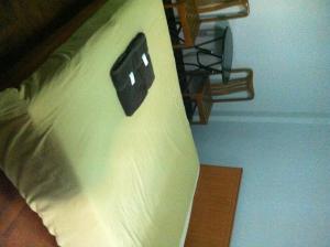 a close up of a bed with an object on it at White Orchid Inn I in Bangkok