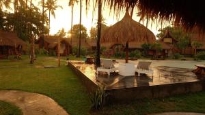 Ein Garten an der Unterkunft Beranda Ecolodge