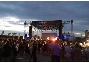 a crowd of people standing in front of a stage at Apartments Barbati in Kustići