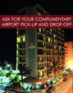 a sign that says ask for your complimentary airport pick up and drop off at Lancaster Raouche Hotel in Beirut