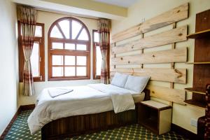 Postel nebo postele na pokoji v ubytování Hotel Pomelo House
