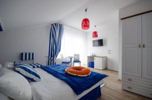 Postel nebo postele na pokoji v ubytování Pokoje Gościnne Hafen Guesthouse - Władysławowo