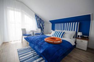 Postel nebo postele na pokoji v ubytování Pokoje Gościnne Hafen Guesthouse - Władysławowo