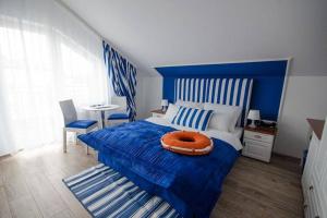Postel nebo postele na pokoji v ubytování Pokoje Gościnne Hafen Guesthouse - Władysławowo
