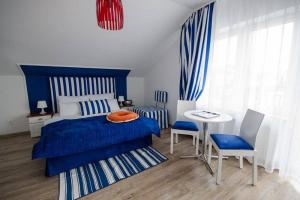 Postel nebo postele na pokoji v ubytování Pokoje Gościnne Hafen Guesthouse - Władysławowo