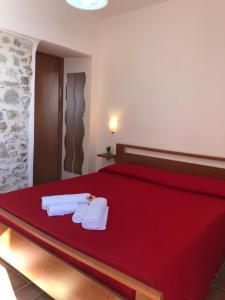 Postel nebo postele na pokoji v ubytování Cala San Francesco B&B