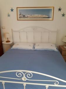 A bed or beds in a room at Il Rifugio Sul Mare